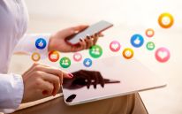 Social Media Icons and mobile in hand